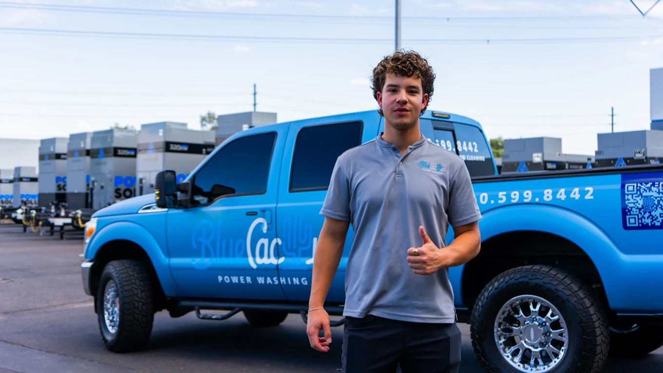 Blue Cactus team member with branded truck